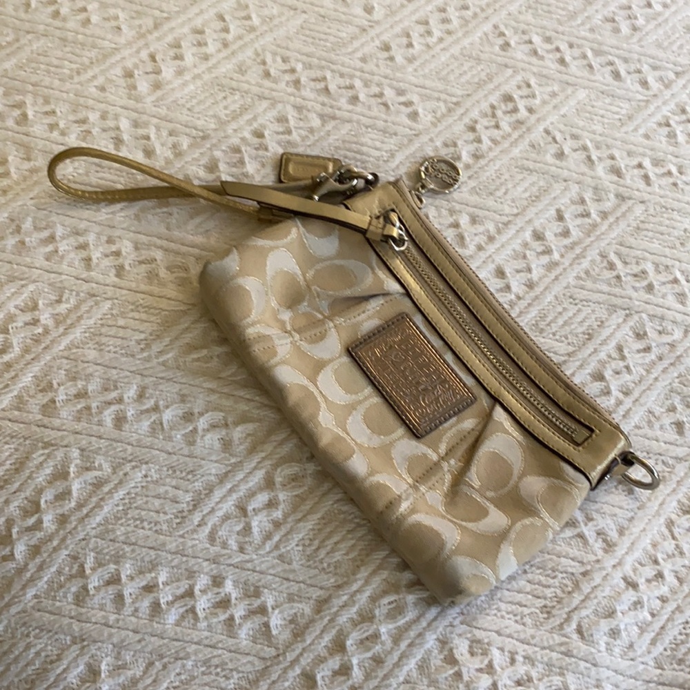 Gold and ivory coach wristlet